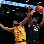 
              Xavier's Jerome Hunter (21) grabs a rebound next to Iowa State's Tristan Enaruna (23) during the first half of an NCAA college basketball game in the NIT Season Tip-Off tournament Wednesday, Nov. 24, 2021, in New York. (AP Photo/Adam Hunger)
            