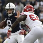 
              Penn State quarterback Christian Veilleux (9) looks to fend off Rutgers linebacker Mohamed Toure (58) during an NCAA college football game in State College, Pa., Saturday, Nov. 20, 2021. Penn State shut out Rutgers 28-0. (AP Photo/Barry Reeger)
            