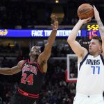 
              Dallas Mavericks guard Luka Doncic shoots against Chicago Bulls forward Javonte Green during the first half of an NBA basketball game in Chicago, Wednesday, Nov. 10, 2021. (AP Photo/Nam Y. Huh)
            