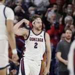 
              Gonzaga forward Drew Timme (2) celebrates his basket against Texas during the first half of an NCAA college basketball game Saturday, Nov. 13, 2021, in Spokane, Wash. (AP Photo/Young Kwak)
            