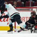 
              Seattle Kraken right wing Nathan Bastian, left, gets ready to send the puck past Arizona Coyotes goalie Scott Wedgewood (31) for a goal during the first period of an NHL hockey game Saturday, Nov. 6, 2021, in Glendale, Ariz. (AP Photo/Ross D. Franklin)
            