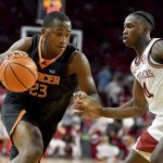
              Mercer forward James Glisson III (23) tries to drive past Arkansas guard Davonte Davis (4) during the second half of an NCAA college basketball game Tuesday Nov. 9, 2021, in Fayetteville, Ark. (AP Photo/Michael Woods)
            