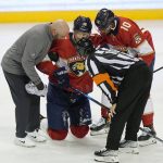
              Florida Panthers center Aleksander Barkov (16) is helped off the ice after a play during the second period of an NHL hockey game against the New York Islanders, Tuesday, Nov. 16, 2021, in Sunrise, Fla. (AP Photo/Wilfredo Lee)
            