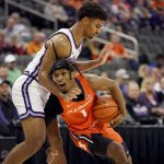 
              Illinois' Trent Frazier (1) drives under pressure from Kansas State's Mark Smith during the first half of an NCAA college basketball game Tuesday, Nov. 23, 2021, in Kansas City, Mo. (AP Photo/Charlie Riedel)
            