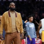 
              Los Angeles Lakers' LeBron James reacts after a point during the first half of an NBA basketball game against the Charlotte Hornets in Los Angeles, Monday, Nov. 8, 2021. (AP Photo/Ashley Landis)
            