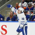 
              Toronto Maple Leafs' Mitchell Marner (16) celebrates after scoring a goal during the first period of an NHL hockey game against the New York Islanders Sunday, Nov. 21, 2021, in Elmont, N.Y. (AP Photo/Frank Franklin II)
            