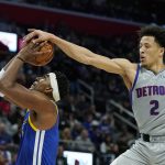 
              Detroit Pistons guard Cade Cunningham (2) is unable to block a shot by Golden State Warriors center Kevon Looney during the second half of an NBA basketball game, Friday, Nov. 19, 2021, in Detroit. (AP Photo/Carlos Osorio)
            