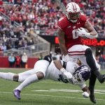 
              Wisconsin's Braelon Allen gets past Northwestern's Cameron Mitchell during the first half of an NCAA college football game Saturday, Nov. 13, 2021, in Madison, Wis. (AP Photo/Morry Gash)
            