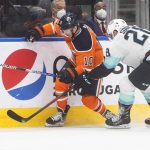 
              Seattle Kraken's Carson Soucy (28) and Edmonton Oilers' Derek Ryan (10) battle for the puck during the second period of an NHL hockey game, Monday, Nov. 1, 2021 in Edmonton, Alberta. (Jason Franson/The Canadian Press via AP)
            