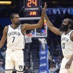 
              Brooklyn Nets forward Kevin Durant (7) and guard James Harden (13) high-five after a basket during the first half of the team's NBA basketball game against the Orlando Magic, Wednesday, Nov. 10, 2021, in Orlando, Fla. (AP Photo/Phelan M. Ebenhack)
            