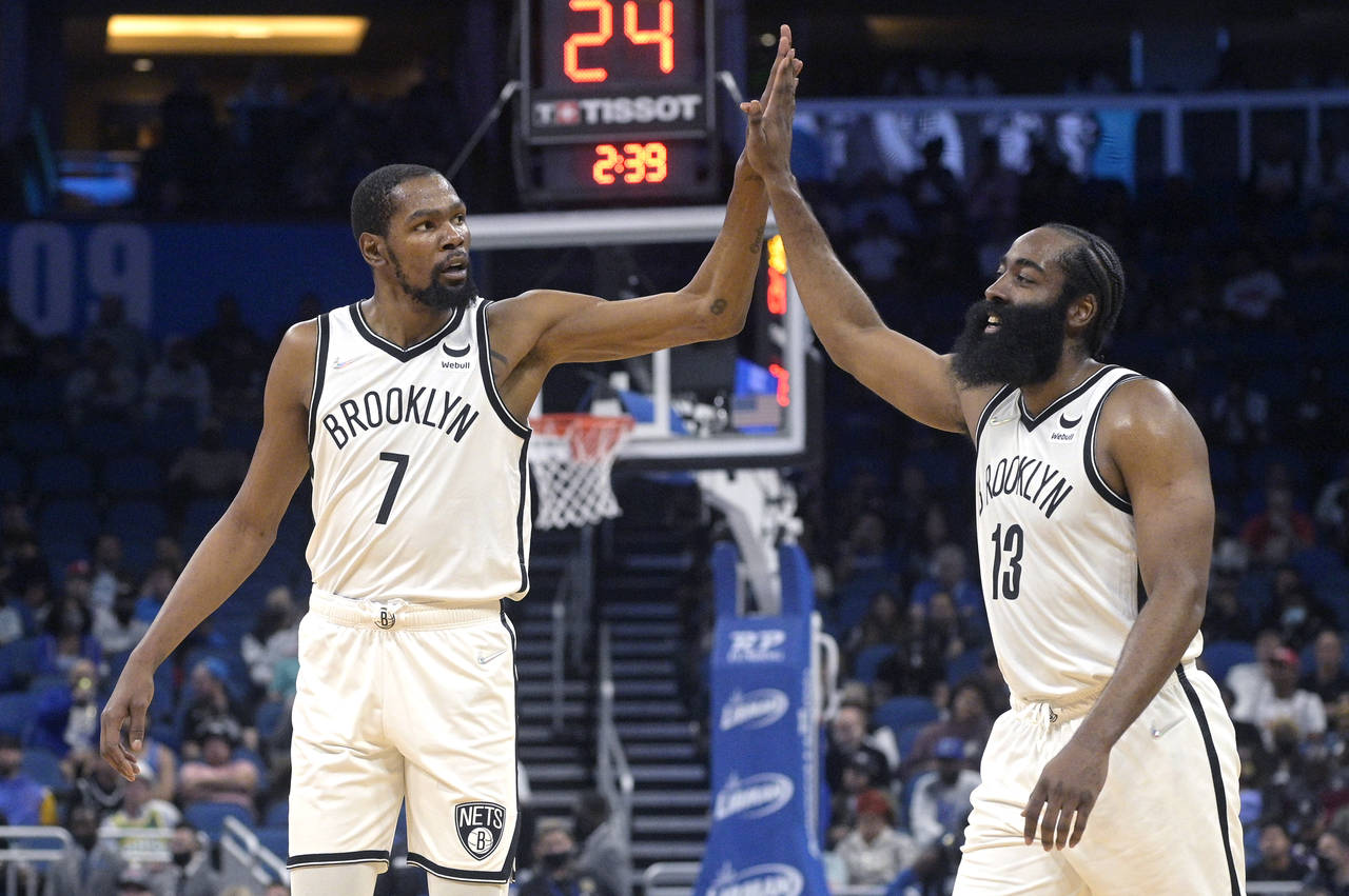 Brooklyn Nets forward Kevin Durant (7) and guard James Harden (13) high-five after a basket during ...