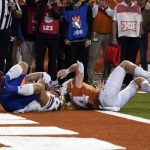 
              Kansas fullback Jared Casey, left, catches a 2-point conversion past Texas defensive back Brenden Schooler, right, to defeat Texas 57-56 in overtime of an NCAA college football game in Austin, Texas, Saturday, Nov. 13, 2021. (AP Photo/Chuck Burton)
            