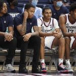 
              From the left, Connecticut freshmen Corey Floyd Jr., Jordan Hawkins, Rahsool Diggins, and Richie Springs watch play in the second half of an NCAA college basketball game against Central Connecticut State University, Tuesday, Nov. 9, 2021, in Storrs, Conn. (AP Photo/Jessica Hill)
            