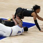 
              Vanderbilt's Myles Stute, right, dives for a loose ball as Pittsburgh's Daniel Oladapo (4) and Quentin Millora-Brown tangle on the floor during the first half of an NCAA college basketball game, Wednesday, Nov. 24, 2021, in Pittsburgh. (AP Photo/Keith Srakocic)
            
