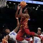
              Iowa State's Izaiah Brockington (1) drives over Memphis' Earl Timberlake (0) during the first half of an NCAA college basketball game in the NIT Season Tip-Off tournament Friday, Nov. 26, 2021, in New York. Brockington was called for a foul. (AP Photo/Adam Hunger)
            