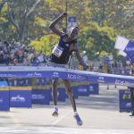 
              Albert Korir of Kenya crosses the finish line first in the men's division of the New York City Marathon in New York, Sunday, Nov. 7, 2021. (AP Photo/Seth Wenig)
            