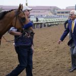 
              Trainer Bob Baffert, right, walks up to Mike Smith on Corniche after winning the Breeders' Cup Juvenile race at the Del Mar racetrack in Del Mar, Calif., Friday, Nov. 5, 2021. (AP Photo/Jae C. Hong)
            