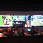 
              This Sept. 9, 2018, photo shows gamblers gathering in a sports betting lounge at the Ocean Casino Resort in Atlantic City N.J,. for the first Sunday of pro football season. On Nov. 17, 2021, New jersey gambling regulators released figures showing that New Jersey's sports betting industry broke its own national record in October, taking in over $1.3 billion worth of sports bets for the month. (AP Photo/Wayne Parry)
            