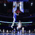 
              Philadelphia 76ers' Furkan Korkmaz (30) goes up for a dunk past New York Knicks' RJ Barrett (9) during the first half of an NBA basketball game, Monday, Nov. 8, 2021, in Philadelphia. (AP Photo/Matt Slocum)
            