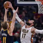 
              New Orleans Pelicans center Jonas Valanciunas (17) blocks the shot of Indiana Pacers forward Domantas Sabonis (11) during the second half of an NBA basketball game in Indianapolis, Saturday, Nov. 20, 2021. The Pacers defeated the Pelicans 111-94. (AP Photo/Michael Conroy)
            
