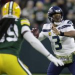 
              Seattle Seahawks' Russell Wilson looks to pass during the first half of an NFL football game against the Green Bay Packers Sunday, Nov. 14, 2021, in Green Bay, Wis. (AP Photo/Matt Ludtke)
            