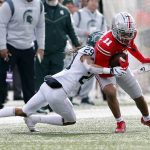 
              Michigan State defensive back Marqui Lowery tackles Ohio State receiver Jaxon Smith-Njigba during the first half of an NCAA college football game Saturday, Nov. 20, 2021, in Columbus, Ohio. (AP Photo/Jay LaPrete)
            
