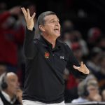
              Maryland coach Mark Turgeon gestures during the first half of the team's NCAA college basketball game against George Mason, Wednesday, Nov. 17, 2021, in College Park, Md. (AP Photo/Nick Wass)
            