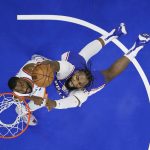
              Philadelphia 76ers' Andre Drummond, right, goes up for a shot over New York Knicks' Kemba Walker during the first half of an NBA basketball game, Monday, Nov. 8, 2021, in Philadelphia. (AP Photo/Matt Slocum)
            