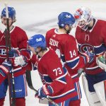 
              Montreal Canadiens goaltender Sam Montembeault (35) celebrates with teammates after defeating the Nashville Predators in an NHL hockey game in Montreal, Saturday, Nov. 20, 2021. (Graham Hughes/The Canadian Press via AP)
            