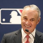 
              Major League Baseball commissioner Rob Manfred smiles Thursday, Nov. 18, 2021, during a news conference in Chicago. (AP Photo/Charles Rex Arbogast)
            