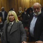 
              FILE — The parents of the late Reeve Steenkamp, June, left, and Barry Steenkamp, right, leave the High Court in Pretoria, South Africa, Wednesday, July 6, 2016. Eight years after he shot dead his girlfriend, Pistorius is up for parole, but first he must meet with her parents as part of the parole procedure. A parole hearing for Pistorius was scheduled for last month and then canceled, partly because a meeting between Pistorius and Steenkamp's parents, Barry and June, had not been arranged, lawyers for both parties told The Associated Press on Monday, Nov. 8, 2021. (Masi Losi/Pool Photo via AP, file)
            