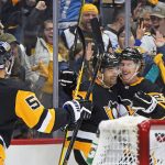 
              Pittsburgh Penguins' Zach Aston-Reese (12) celebrates with Brock McGinn (23) and Teddy Blueger (53) after scoring during the second period of the team's NHL hockey game against the Vancouver Canucks in Pittsburgh, Wednesday, Nov. 24, 2021. (AP Photo/Gene J. Puskar)
            