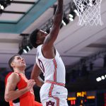 
              In this photo provided by Bahamas Visual Services, Auburn guard K.D. Johnson (0) goes to the basket during an NCAA college basketball game against Syracuse at Paradise Island, Bahamas, Friday, Nov. 26, 2021. (Tim Aylen/Bahamas Visual Services via AP)
            