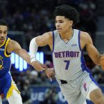 
              Detroit Pistons guard Killian Hayes (7) drives as Golden State Warriors guard Jordan Poole (3) defends during the first half of an NBA basketball game, Friday, Nov. 19, 2021, in Detroit. (AP Photo/Carlos Osorio)
            