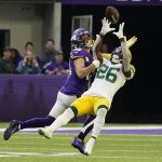 
              Green Bay Packers free safety Darnell Savage (26) breaks up a pass intended for Minnesota Vikings wide receiver Adam Thielen (19) during the second half of an NFL football game, Sunday, Nov. 21, 2021, in Minneapolis. (AP Photo/Jim Mone)
            