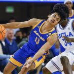
              Cal State Bakersfield guard Dalph Panopio (13) drives against UCLA guard David Singleton (34) during the second half of an NCAA college basketball game Tuesday, Nov. 9, 2021, in Los Angeles. UCLA won 95-58. (AP Photo/Ringo H.W. Chiu)
            