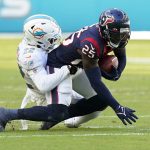 
              Miami Dolphins defensive back Elijah Campbell (22) tackles Houston Texans defensive back Desmond King (25) during the first half of an NFL football game, Sunday, Nov. 7, 2021, in Miami Gardens, Fla. (AP Photo/Wilfredo Lee)
            