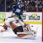 
              Vancouver Canucks' Bo Horvat's shot bounces off the post and stays out of the net behind Anaheim Ducks goalie John Gibson (36) during the second period of an NHL hockey game in Vancouver, British Columbia, on Tuesday, Nov. 9, 2021. (Darryl Dyck/The Canadian Press via AP)
            