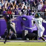 
              TCU wide receiver Blair Conwright (22) catches a pass for a long gain as Baylor cornerback Al Walcott (13) defends in the first half of an NCAA college football game in Fort Worth, Texas, Saturday, Nov. 6, 2021. (AP Photo/Tony Gutierrez)
            