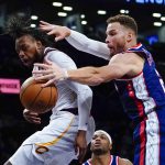 
              Brooklyn Nets' Blake Griffin, right, deflects a pass from Cleveland Cavaliers' Darius Garland during the first half of an NBA basketball game Wednesday, Nov. 17, 2021 in New York. (AP Photo/Frank Franklin II)
            