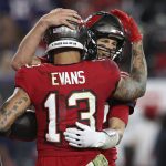 
              Tampa Bay Buccaneers wide receiver Mike Evans (13) hugs quarterback Tom Brady (12) after Evans caught a 5-yard touchdown pass during the second half of an NFL football game against the New York Giants Monday, Nov. 22, 2021, in Tampa, Fla. (AP Photo/Mark LoMoglio)
            