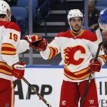 
              Calgary Flames left wing Johnny Gaudreau (13) celebrates his goal with left wing Matthew Tkachuk (19) during the second period of an NHL hockey game against the Buffalo Sabres, Thursday, Nov. 18, 2021, in Buffalo, N.Y. (AP Photo/Jeffrey T. Barnes)
            