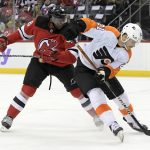 
              Philadelphia Flyers left wing Scott Laughton (21) skates with the puck as he is checked by New Jersey Devils defenseman P.K. Subban (76) during the first period of an NHL hockey game Sunday, Nov. 28, 2021, in Newark, N.J. (AP Photo/Bill Kostroun)
            