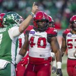 
              Calgary Stampeders defensive lineman Shawn Lemon (40) looks on moments before getting ejected from the game after throwing a punch during the first half of a CFL football game against the Saskatchewan Roughriders Sunday, Nov. 28, 2021 in Regina, Saskatchewan. (Kayle Neis/The Canadian Press via AP)
            