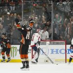 
              Anaheim Ducks center Adam Henrique (14) and center Troy Terry (19) react after defenseman Cam Fowler scored a goal during the first period of an NHL hockey game against the Washington Capitals in Anaheim, Calif., Tuesday, Nov. 16, 2021. (AP Photo/Ashley Landis)
            