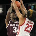 
              Texas A&M guard Quenton Jackson (3) tries to shoot over Wisconsin guard Chucky Hepburn in the first half of an NCAA college basketball game at the Maui Invitational in Las Vegas, Monday, Nov. 22, 2021. (AP Photo/Rick Scuteri)
            