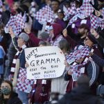 
              Colorado Rapids fans welcome their team to the pitch to face the Portland Timbers in an MLS Western Conference semifinal playoff soccer match Thursday, Nov. 25, 2021, in Commerce City, Colo. (AP Photo/David Zalubowski)
            