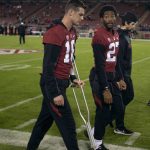
              Stanford quarterback Tanner McKee (18) walks with the aid of a crutch before the team's NCAA college football game against Utah, Friday, Nov. 5, 2021, in Stanford, Calif. (AP Photo/D. Ross Cameron)
            