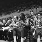 
              FILE - Boston Coach Red Auerbach and Bill Russell watch action as they shake hands on the bench in the final seconds of the Celtics' 112-99 win over the Lakers in an NBA playoff game at Los Angeles April 23, 1965. Russell had just left the game -- for the first time -- with less than a minute to play. (AP Photo/Ed Widdis, File)
            