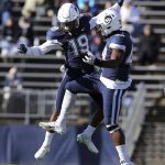 
              Connecticut defensive back Durante Jones (19) and defensive lineman Kevon Jones (48) celebrate a defensive stop during the first half of an NCAA football game against Houston, Saturday, Nov. 27, 2021, in East Hartford, Conn. (AP Photo/Stew Milne)
            